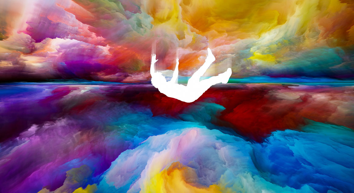 Person falling through colourful clouds.